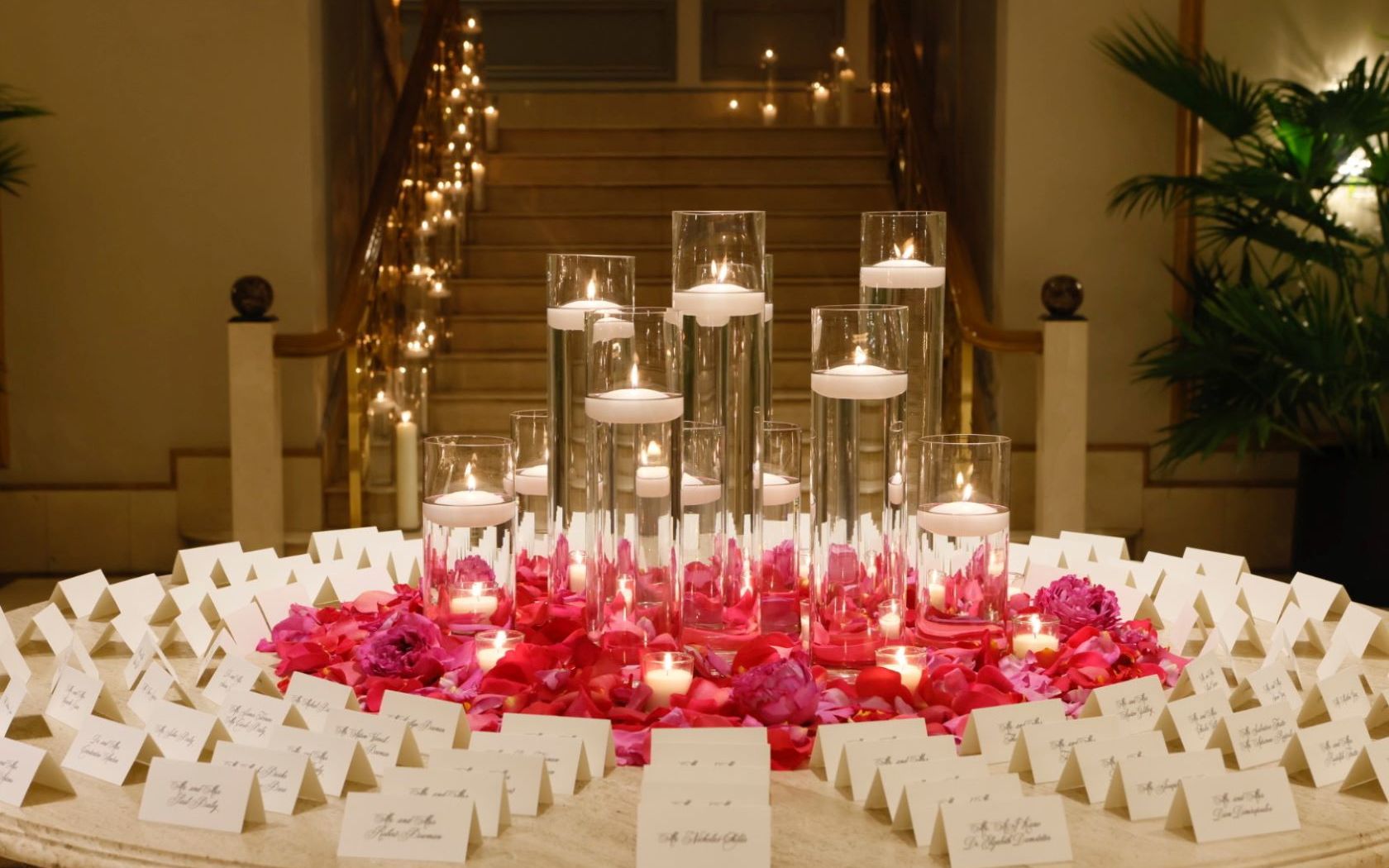 A Table With Candles And Flowers